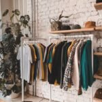 Fashionable interior of a modern boutique in Birmingham, England with vintage clothing and chic decor.